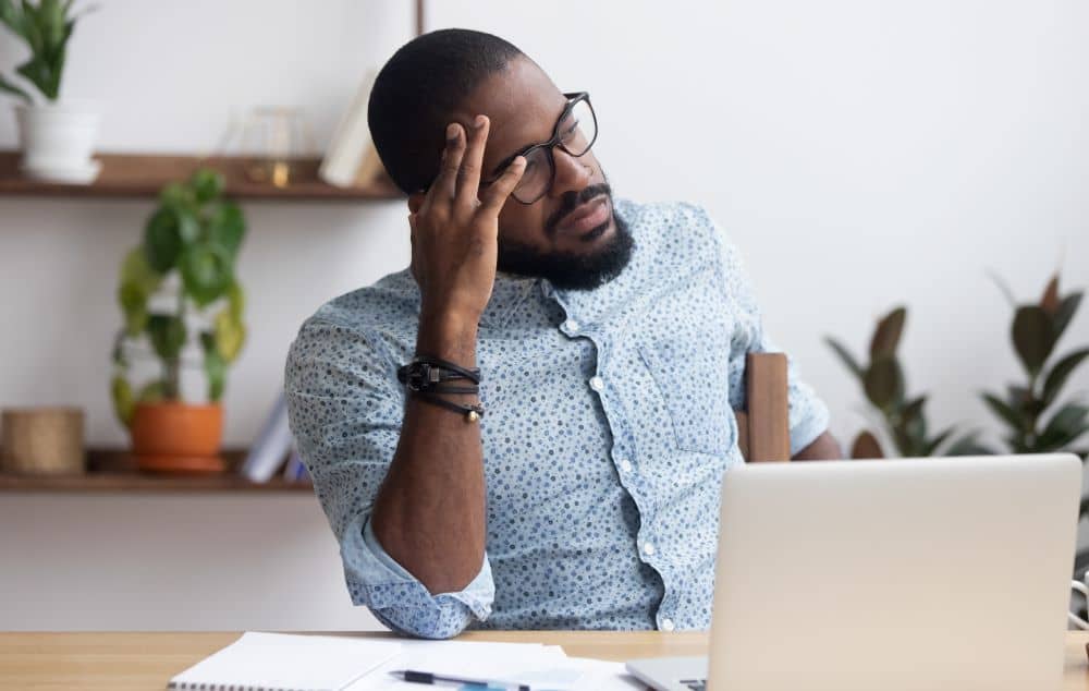 Man unable to focus at work.